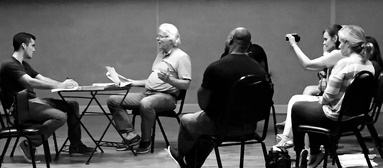 Actors rehearsing a scene while classmates watch in an Atlanta acting class
